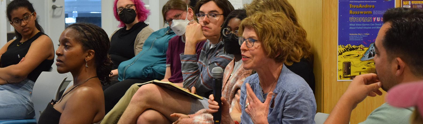 People seated and speaking.